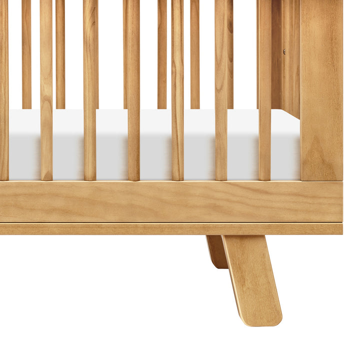 Closeup of Babyletto Hudson 3-in-1 Convertible Crib And Toddler Rail leg in -- Color_Honey
