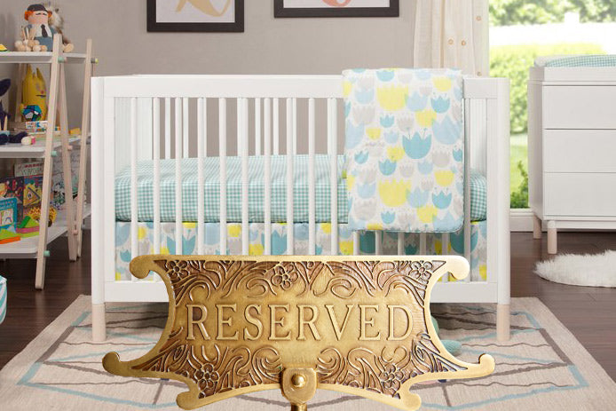 babyletto gelato crib with golden RESERVED sign on it
