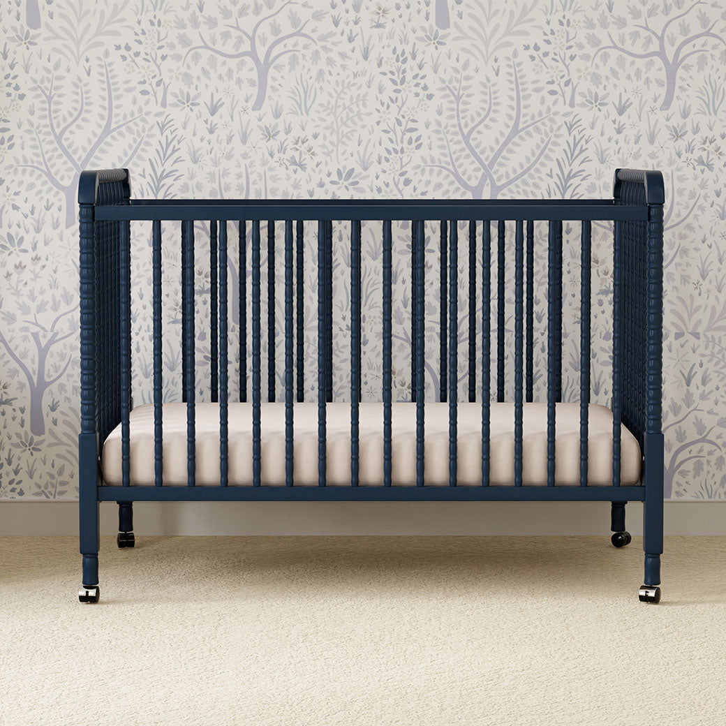 Front view of DaVinci’s Jenny Lind Crib in a room in -- Color_Navy