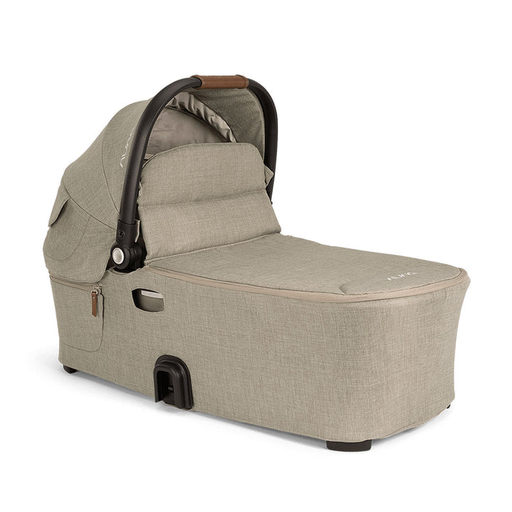Bassinet with visor up of the Nuna DEMI Next Bassinet + Stand in -- Color_Hazelwood