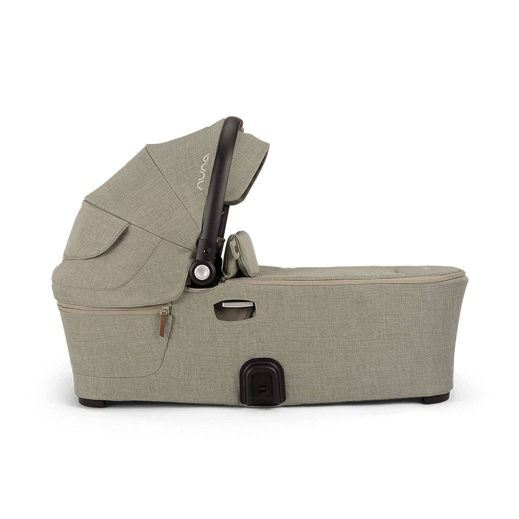 Side view of bassinet of the Nuna DEMI Next Bassinet + Stand in -- Color_Hazelwood