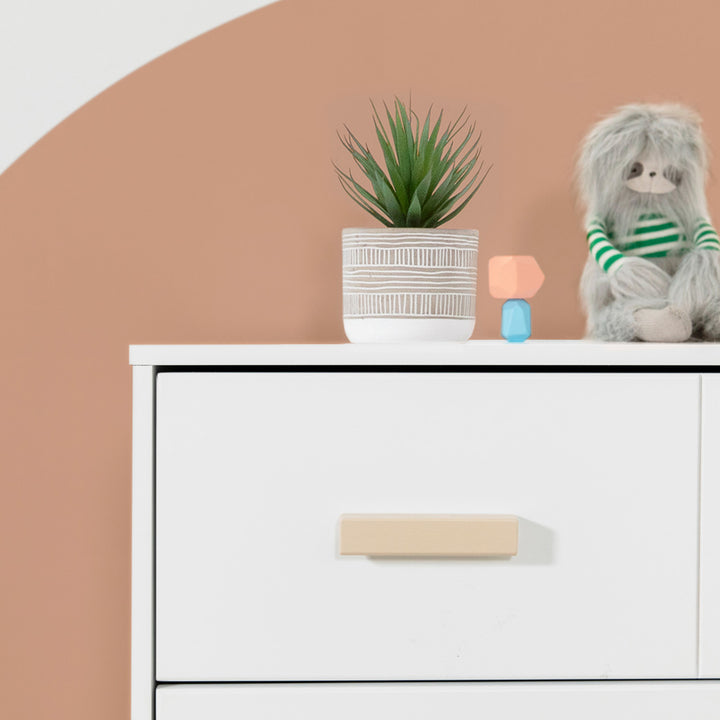 Closeup of item on the Babyletto's Scoot 3-Drawer Changer Dresser in -- Color_Washed Natural/White