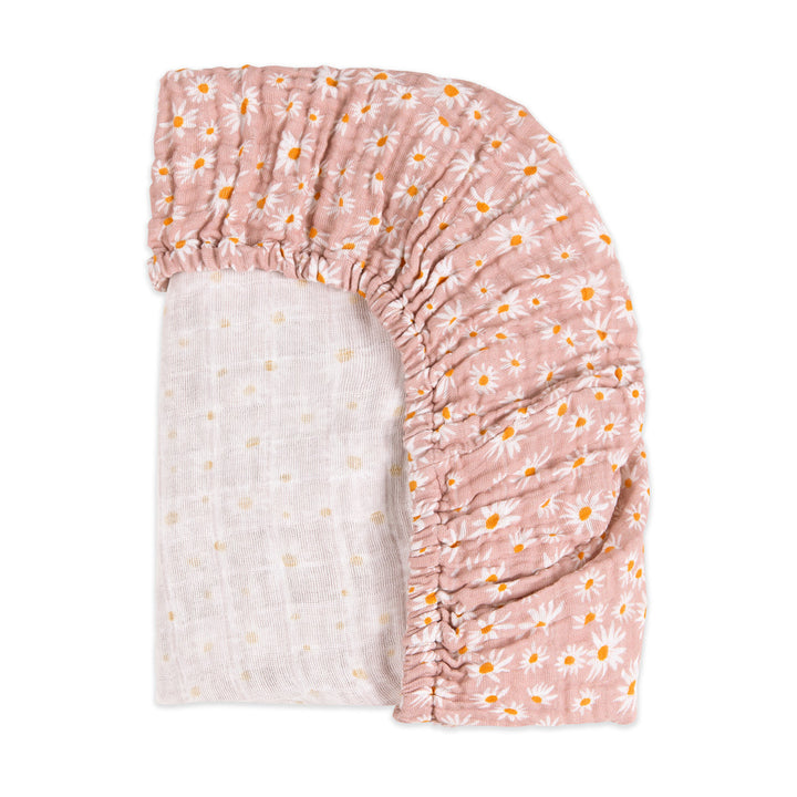 Back corner view of Babyletto's All-Stages Midi Crib Sheet In GOTS Certified Organic Muslin Cotton in -- Color_Daisy