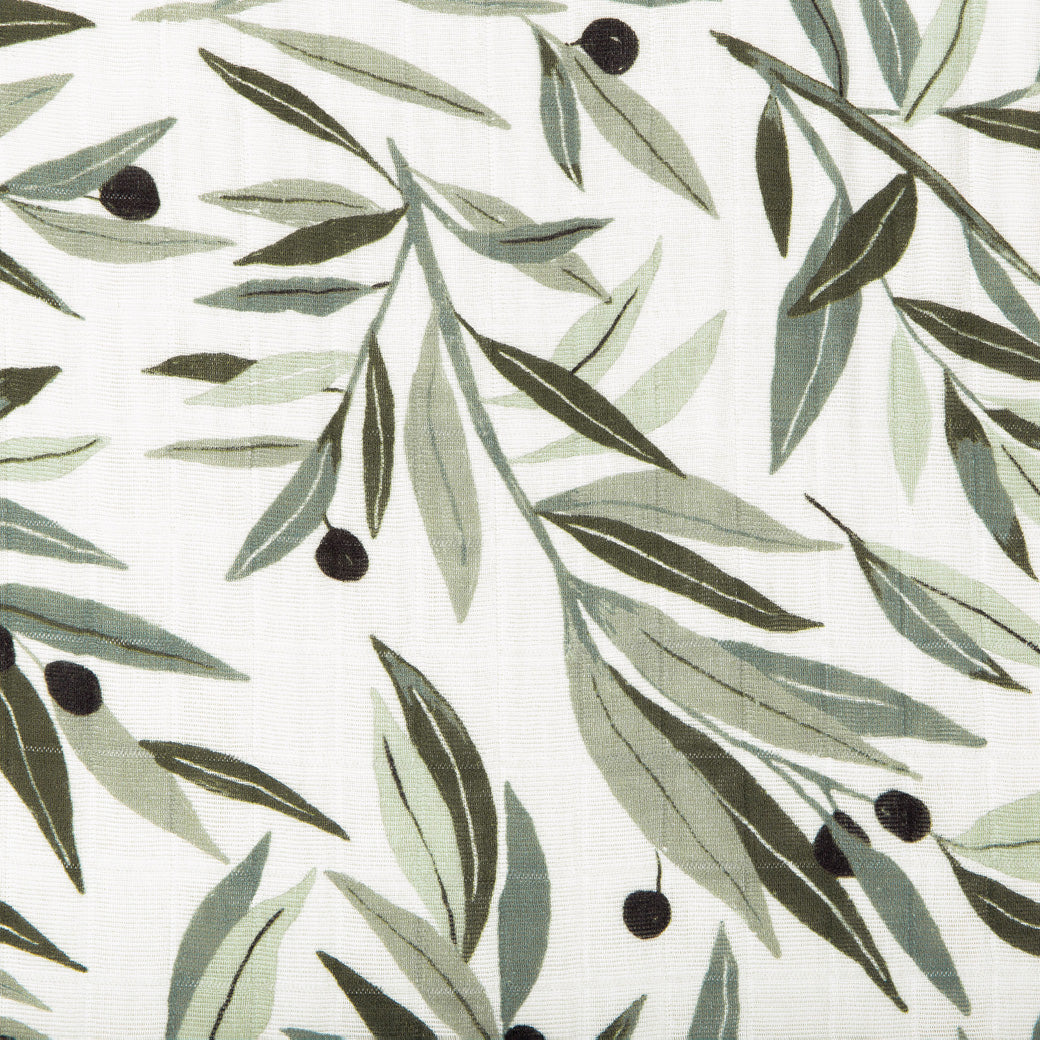 Closeup of pattern of Babyletto's All-Stages Midi Crib Sheet In GOTS Certified Organic Muslin Cotton in -- Color_Olive Branches